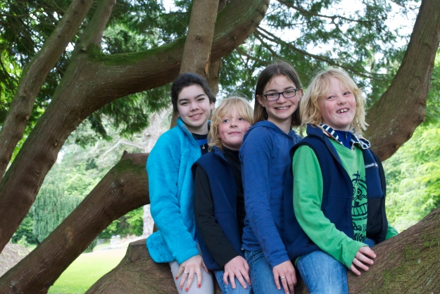 All four cousins on the tree- indulging their parents and grandparents for a photo